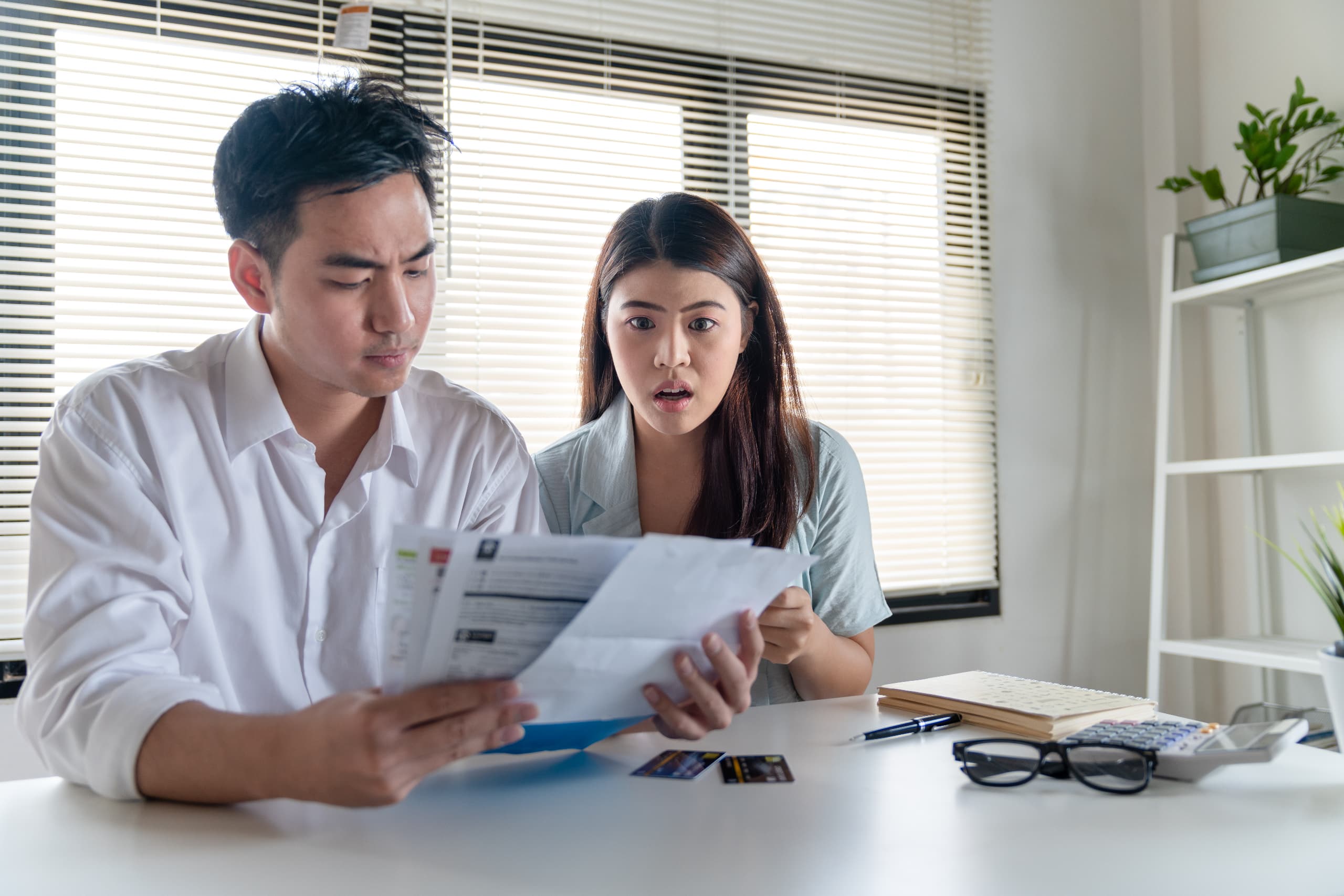 young couple stressed about water bill